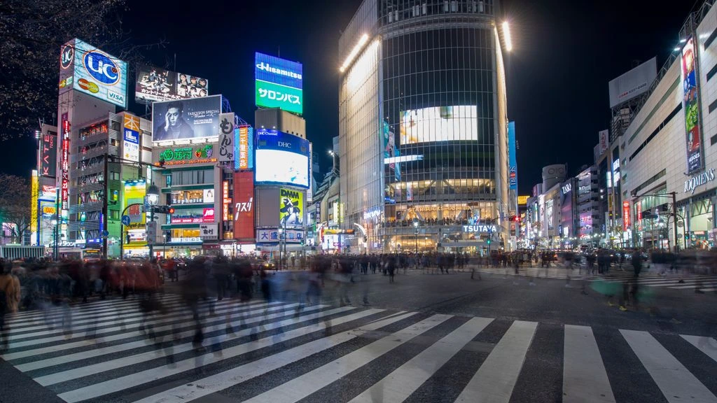 Shibuya crossing at blue hour under rain and neon, from the Neon Tokyo Nights collection